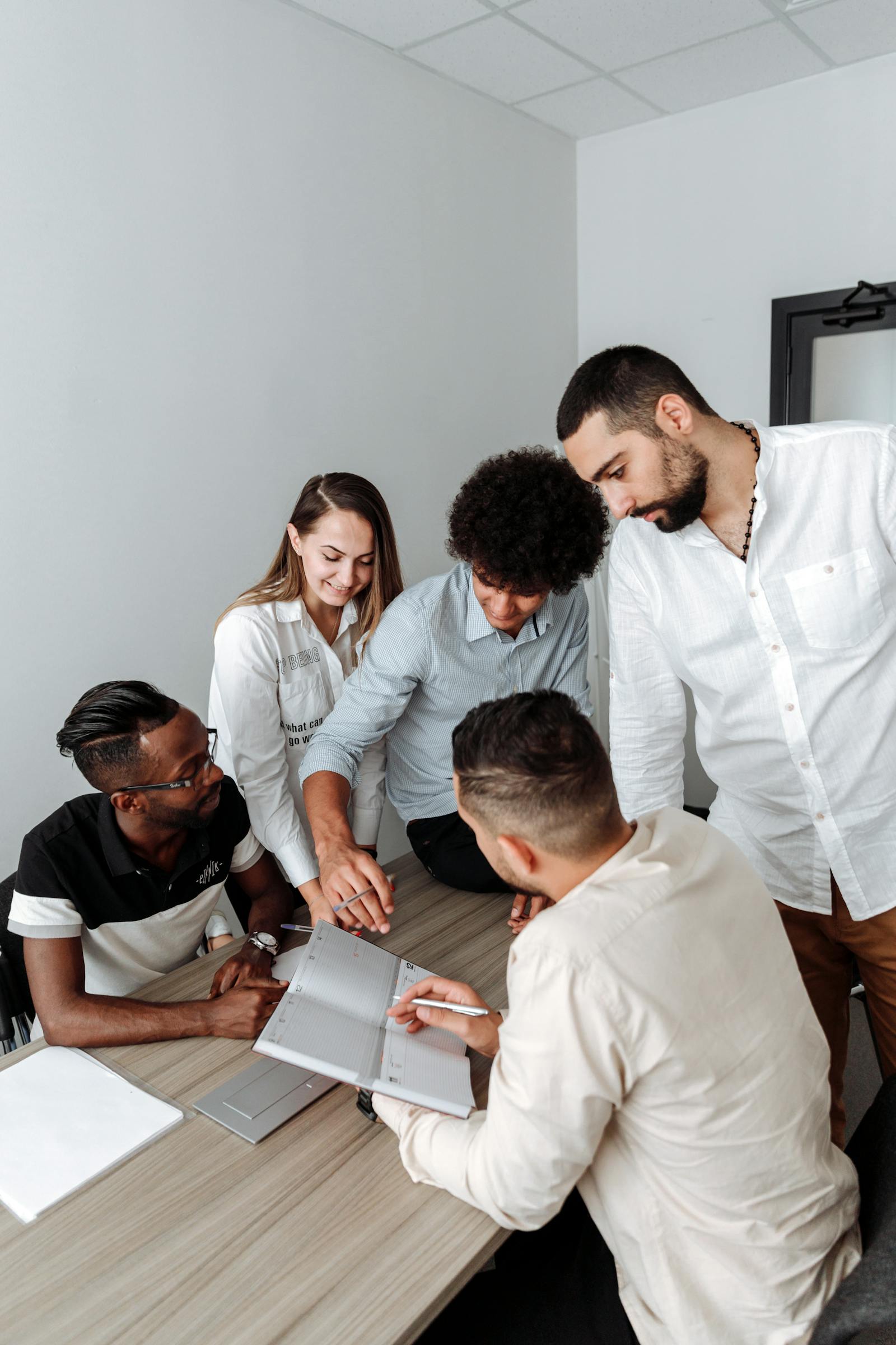 Octbe team members working together around a shared plan