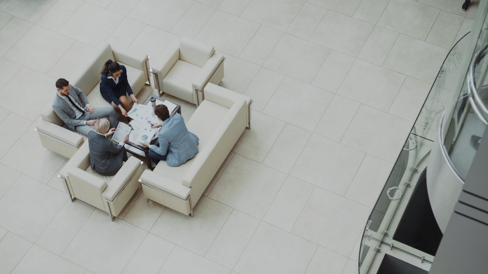 Business team reviewing documents and procurement analytics resources together