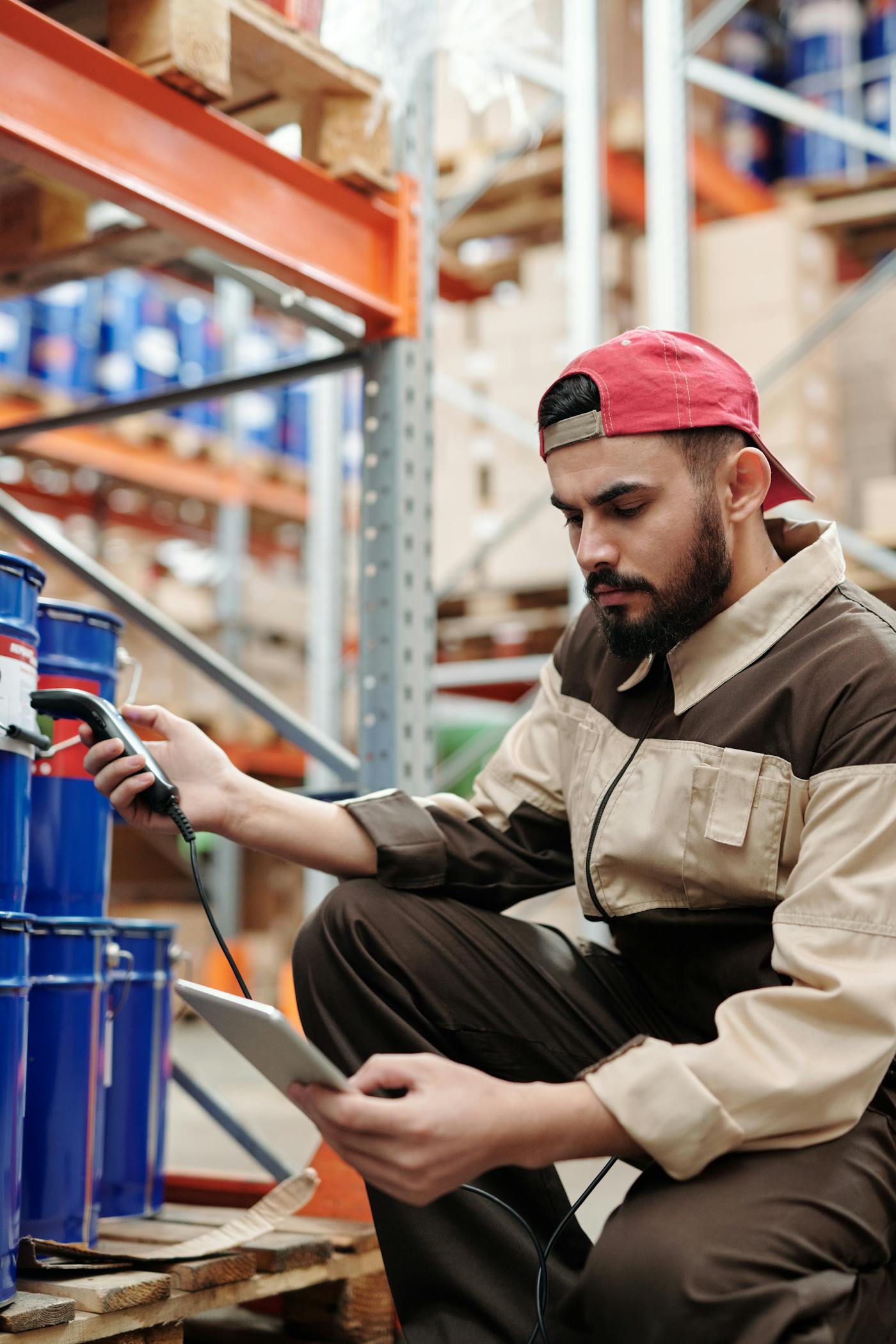 Warehouse operator reviewing supply chain risk and supplier performance